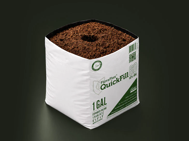 Close-up of QuickFill O2 Covered Top coco coir bag with pre-drilled center hole for a 40|40 plug and two pre-drilled side holes for dripper assemblies